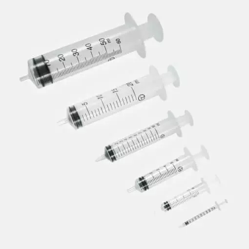 Six medical syringes of different sizes arranged diagonally
