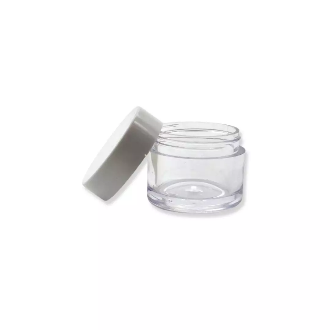 Small clear cosmetic jar with open white lid