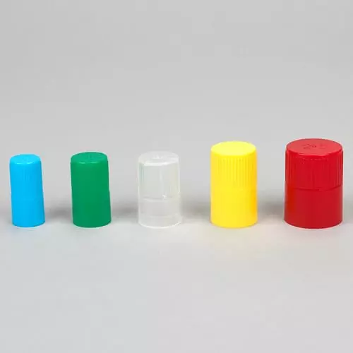 Five colourful plastic caps in a row